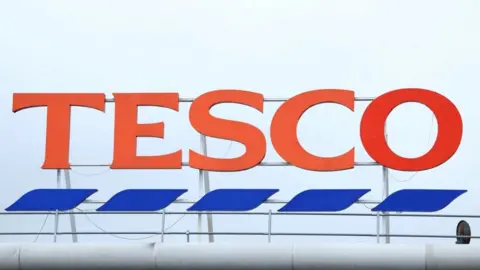 Reuters Tesco sign