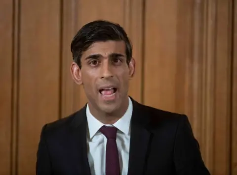 Getty Images Chancellor of the Exchequer Rishi Sunak speaks during a daily press conference at 10 Downing Street.