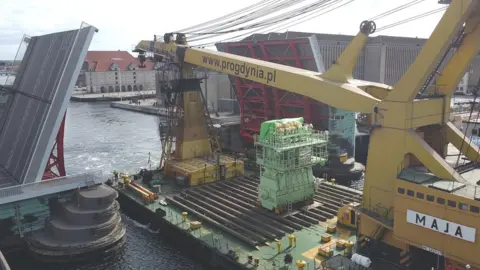 Man MAN engine being shipped through Copenhagen