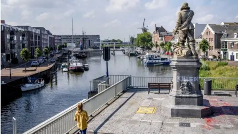 EPA The word "killer" was daubed on Piet Hein's statue in Rotterdam last month