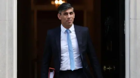 EPA-EFE/REX/Shutterstock Rishi Sunak leaving Number 10 to attend PMQs on 17 April