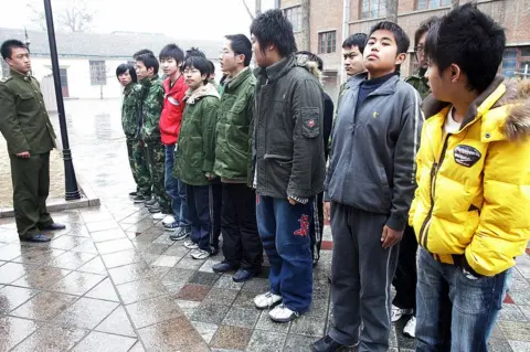 AFP/Getty Images Some 20-odd teenagers assemble at the Internet Addiction Treatment Centre in the southeastern suburb of Daxing in Beijing, 1 March 2007, all placed there involuntarily by their family, to go through a strict regimen that might as well be boot camp -- and for good reason, since this is an army-run clinic inside a military district.