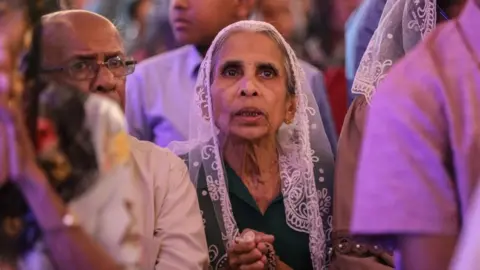 EPA Worshippers attend Christmas Eve midnight mass at the St. Francis Xavier's Church in Katana, Sri Lanka, early 25 December 2023.