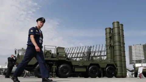 EPA File photo: A Russian military official walks in front of The S-400 Triumph anti-aircraft missile system, 22 August 2017