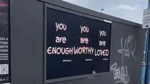 Talk to Coco An affirmation in Cardiff saying "you are enough"