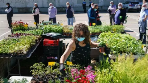 AFP Everybody queuing in this market in Las Torres, near Burgos, was wearing a mask on Wednesday