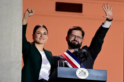 Getty Images Irina Karamanos with Gabriel Boric after taking office in 2022