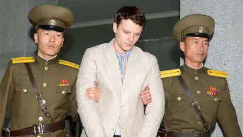 Reuters US student Otto Warmbier is marched into court by two North Korean guards (March 2016)