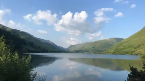 Liz Simpson A mountainous vista reflected in Tal-y-Llyn lake.