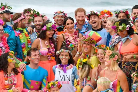 Getty Images Meghan and Harry with OneWave, a local surfing community group