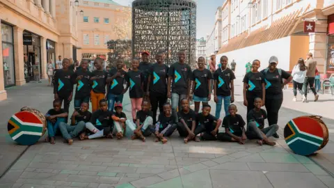 Racehl Oakes A choir of Zulu children singing and dancing