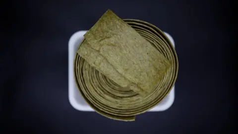 Reuters A photo illustration shows "Injogogi", a textured vegetable protein, at a North Korean food store run by North Korean defector Hong Eun-hye in Seoul, South Korea, 28 September 2017.