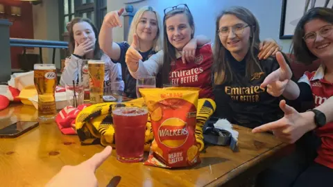 Izzie Larché Arsenal fans at the New Moon in Crawley