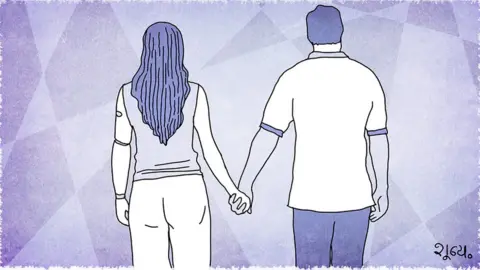 BBC A man and woman holding hands