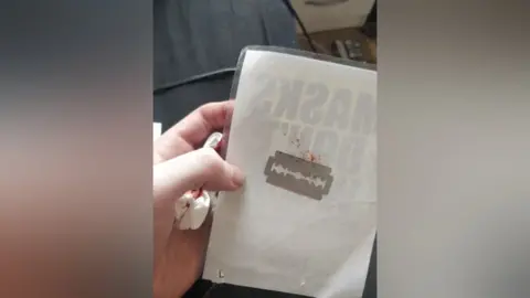 Layla Stokes razor on poster back