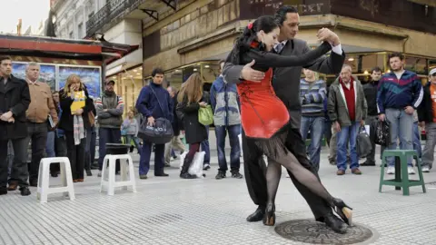 Getty Images Fanny and Fabio, a couple of tango street dancers, perform in the intersection of Florida and Lavalle streets in downtown Buenos Aires