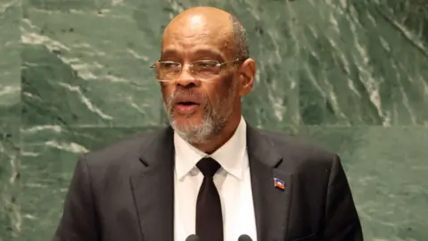 Getty Images Haitian Prime Minister Ariel Henry addresses world leaders during the United Nations (UN) General Assembly on September 22, 2023 in New York City.