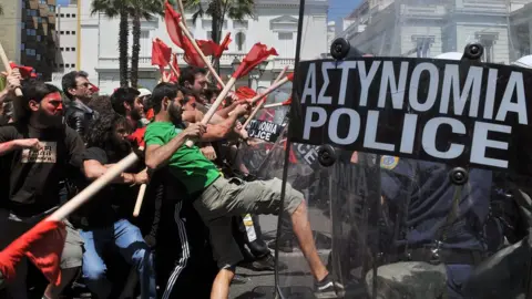 Getty Images Demonstrators clash with policemen outside the greek Parliament during a Mayday demonstration on May 1, 2010, in Athens.