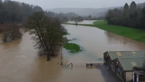 Chris Doel Dundas Aqueduct flooded with trees and some buildings submerged