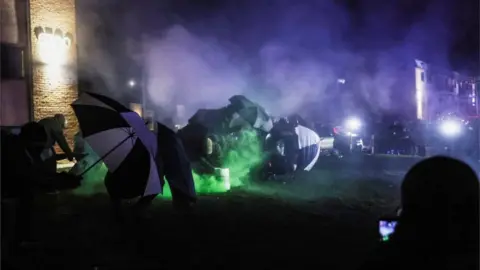 Reuters Protesters shelter from tear gas in Brooklyn Center, Minnesota, April 13, 2021