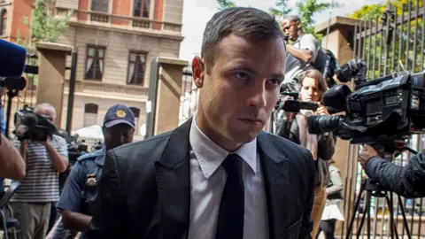 Getty Images Oscar Pistorius arrives for the fourth day of sentencing at North Gauteng High Court on October 16, 2014 in Pretoria, South Africa. Pistorius will be sentenced having been found guilty of the culpable homicide of his girlfriend Reeva Steenkamp after mistaking her for an intruder. (Photo by Charlie Shoemaker/Getty Images)