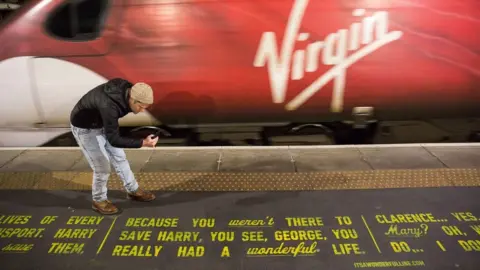 PA It's A Wonderful Life was painted onto a railway station platform at Glasgow Central