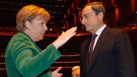 Getty Images File pic from 2011 of Angela Merkel with Mario Draghi