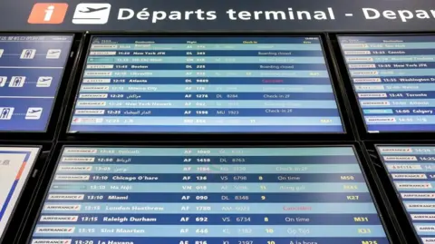 A flight information screen showing cancelled flights destined for the Heathrow International Airport, at the Paris-Charles de Gaulle Airport
