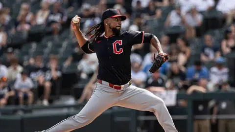 Getty Images Clase throwing a pitch on the pitcher's mound of a bsaeball field, with his arm swung back and an intense look on his face
