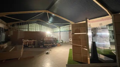 A large empty factory with a new roof, stands bare waiting for the museum exhibits to be added.