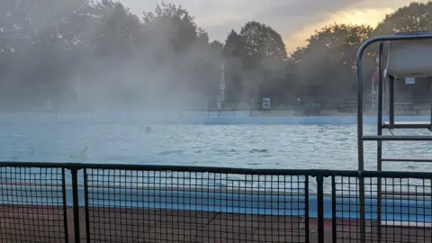Simon Collister Lido in the cold weather with fog around it