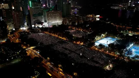 Reuters Thousands of people take part in a candlelight vigil at Victoria Park in Hong Kong to mark the 30th anniversary of Beijing's Tiananmen Square crackdown in 1989
