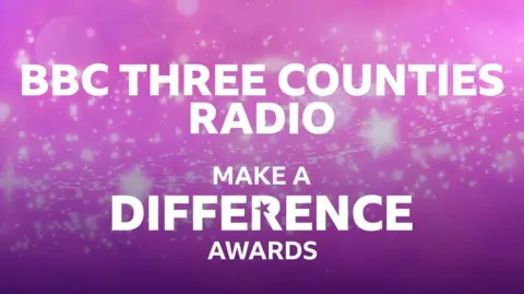 A banner saying "BBC Three Counties Radio Make a Difference Awards" in white writing on a purple background that is also covered in stars and lights.