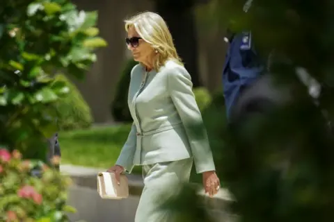 Reuters Jill Biden walks into court in a mint green suit