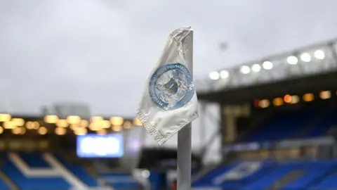 Getty Images A corner flag with Peterborough United's crest on it.