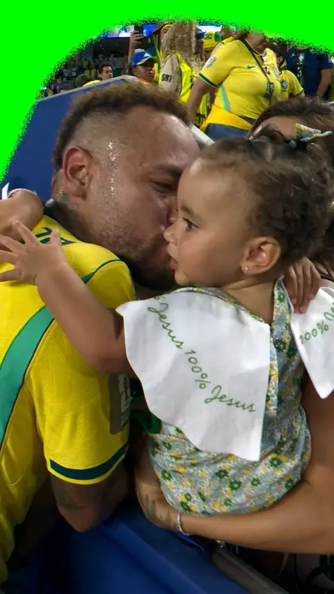 Neymar with his children after making his return to the Brazil team