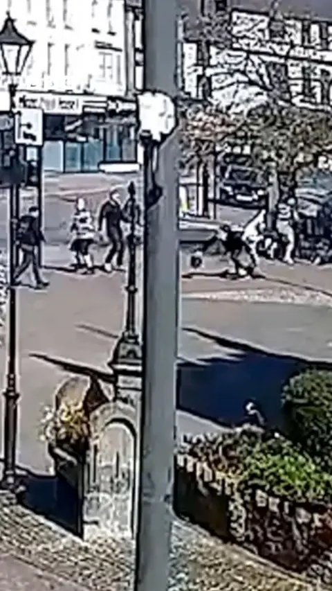 CCTV of a gang attacking in the centre of Coleford.