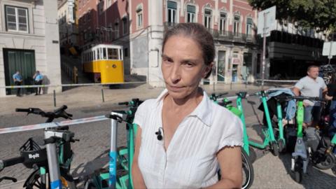 Alison Roberts standing in front of the scene of the Lisbon funicular crash