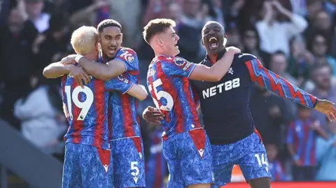 Crystal Palace players celebrate on the pitch