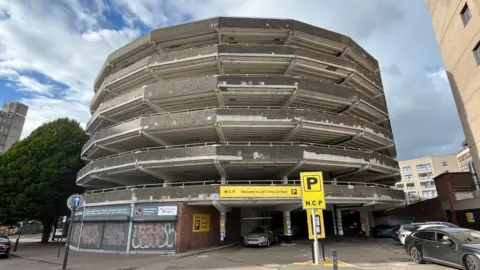 A large concrete multi-storey car park