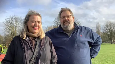 From left to right, Natalia King and Jeremy King look straight at the camera.