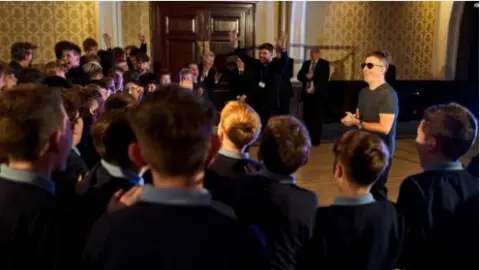 The boys cheer when Britain's Got Talent's Simon Cowell tells them they will be performing on the show