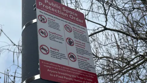 A sign detailing the public space protection order. It includes no alcohol, begging, charity collections and scooters and bikes. 