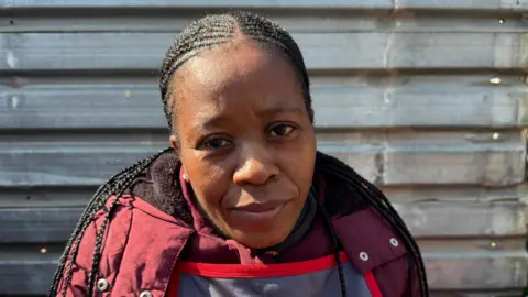 Ed Haberson / BBC Alata Silso was seen wearing a maroon jacket, red and blue.