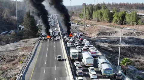 Reuters smoke rises from burning fires on both sides of a major highway in Israel