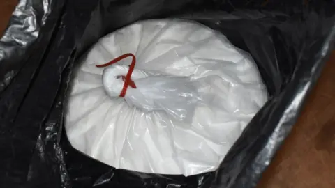 Hertfordshire Police Ketamine: a white plastic bag tied with red tape inside a black plastic bag