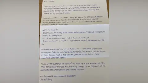 Submitted A Reform UK leaflet written in blue font on a white backdrop. 