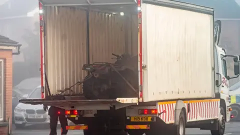 PA Media The quad bike in the back of a white lorry.