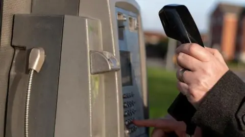 Getty Images A public pay phone.