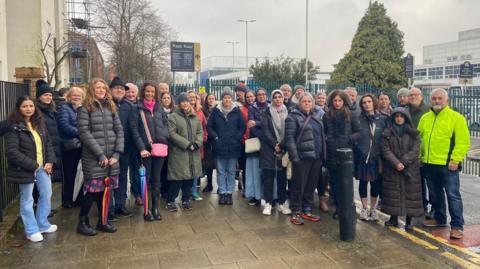 A group of parents stood outside Gosforth Academy